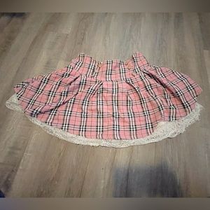 Medium strawberry pink skirt with white laces at the bottom